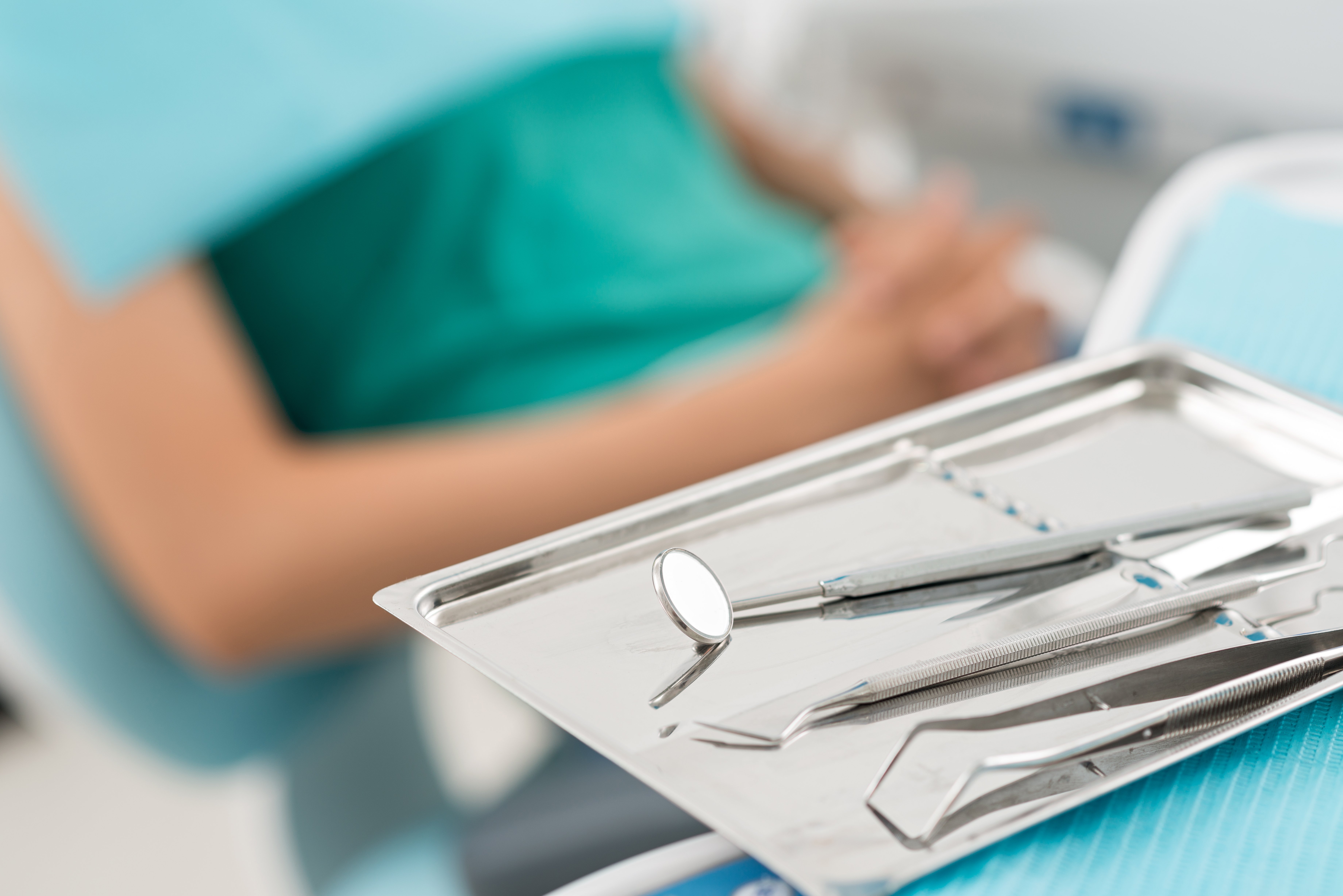 storyblocks-macro-shot-of-shiny-dental-tools_rLl9RBNpWG